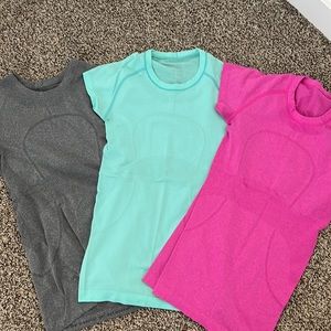Three Lululemon Athletica workout T-shirts. Size 4. Like new.